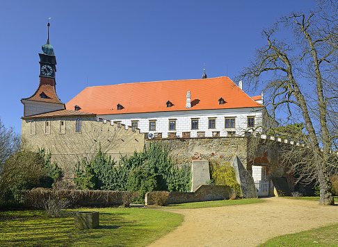 A massive castle on a hill above the river Oslava - The State castle Namest nad Oslavou, Czech Republic