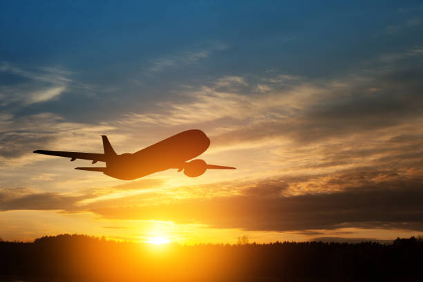 istock Airplane taking off at the sunset sky. 1490762353