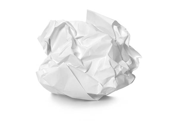 Crumpled paper close-up of a crumpled paper, isolated on white background crumpled paper ball stock pictures, royalty-free photos & images