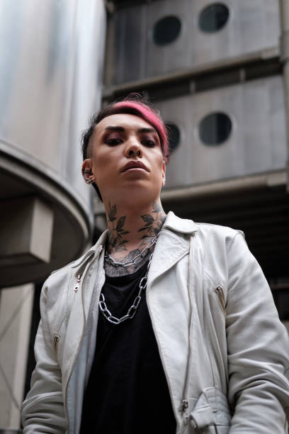 Moody portrait of androgynous non-binary model in futuristic environment.