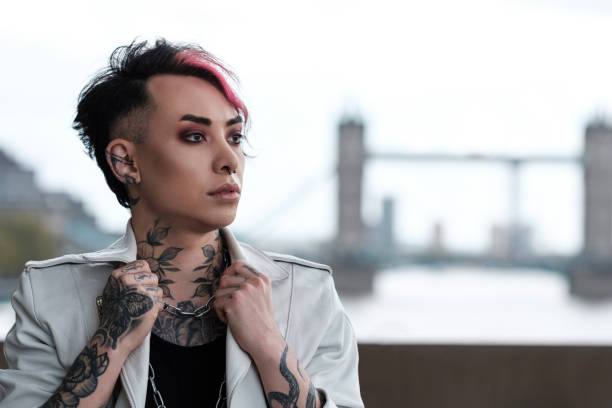 istock Non-binary male with Tower Bridge London like a background. 1490764089