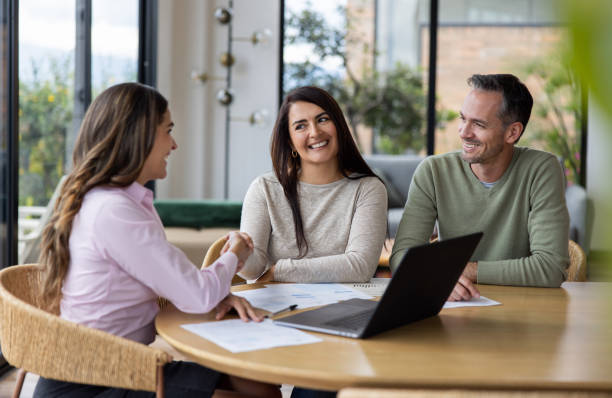 istock Financial advisor handshaking with a couple after reaching an agreement 1490765076