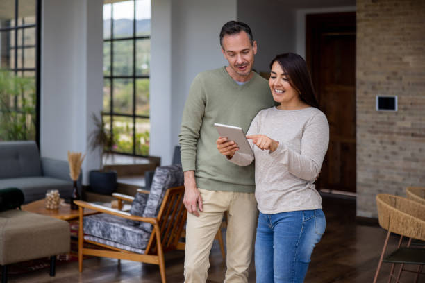 istock Couple at home watching videos on a tablet computer 1490765265
