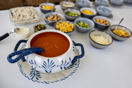 Mexican soup served in a buffet style in beautiful crockery