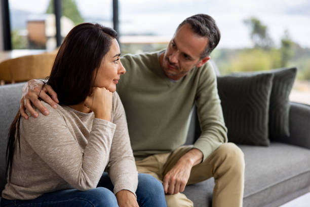 istock Man comforting his wife at home 1490765582