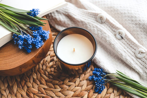 istock Candle and flowers in home atmospheric interior 1490767447