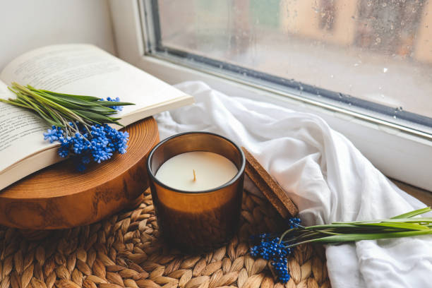 istock Candle and flowers in home atmospheric interior 1490767451