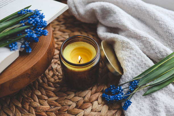 istock Candle and flowers in home atmospheric interior 1490767478