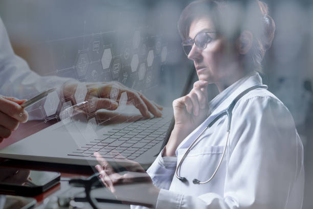 istock Double exposure of doctors meditating and working at computer. 1490767487