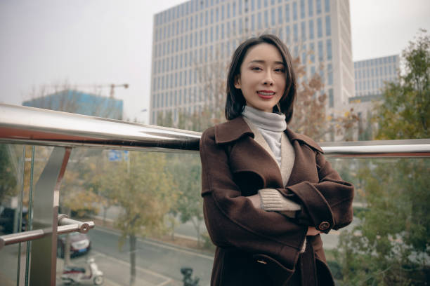 istock Attractive woman in city with arms folded 1490767867