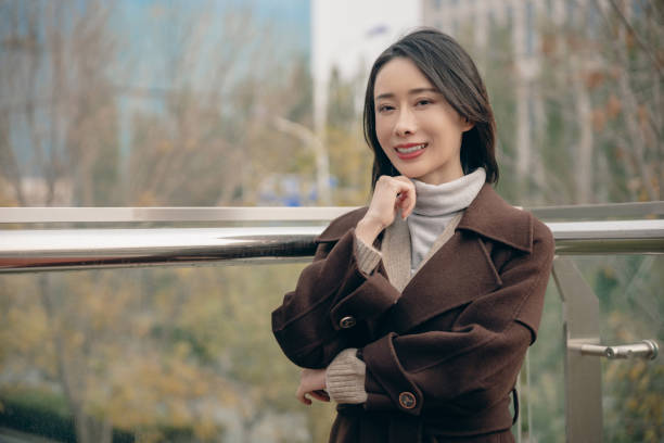 istock Attractive woman in city with arms folded 1490768547