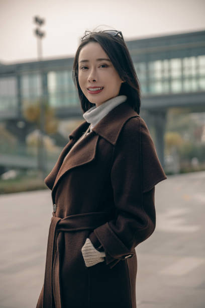istock Attractive woman in city with arms folded 1490769718