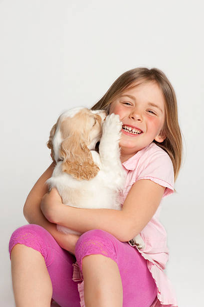 istock Young girl with baby dog 149077005