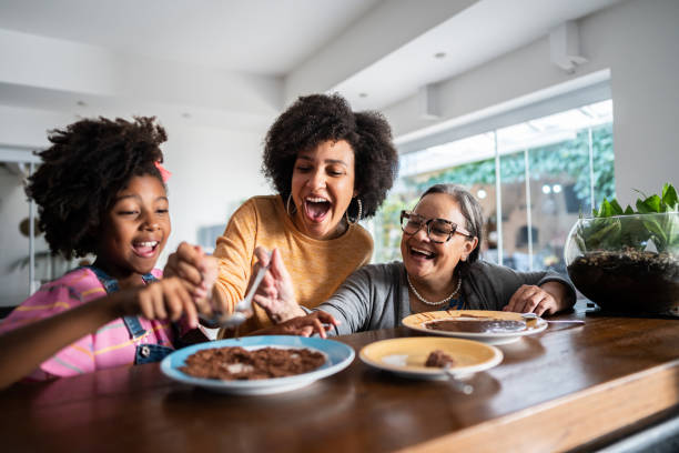 istock Family eating chocolate at home 1490770486