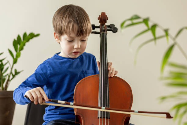 istock White 5 year old boy learning to play the cello 1490774468