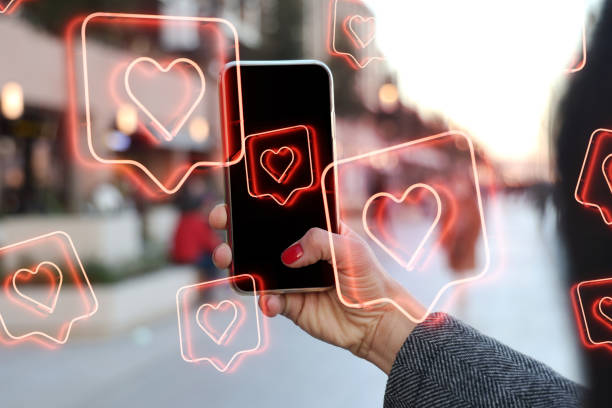 istock Women holding mobile phone with social media notification icon 1490774731