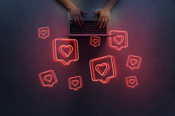 istock Women using laptop with social media notification icon 1490774778