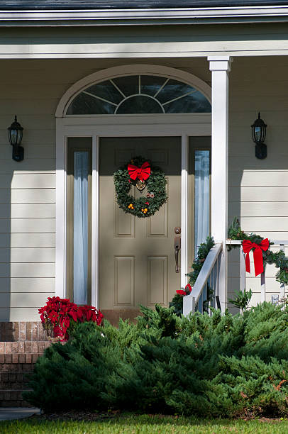 istock Festive Christmas wreath decorated front door 149077565