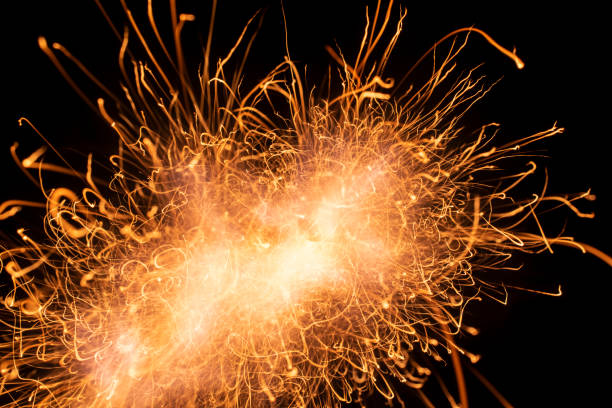 istock fire in dark. luminous lines of sparks. explosion black powder. 1490776344