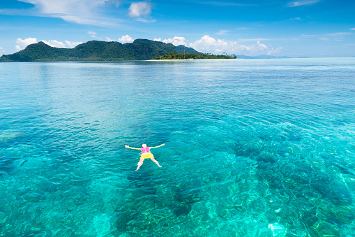 Kids snorkel. Beach fun. Children snorkeling in tropical sea on family summer vacation on exotic island. Child with mask and fins. Travel with family. Little kid learning to dive. Diving holiday.