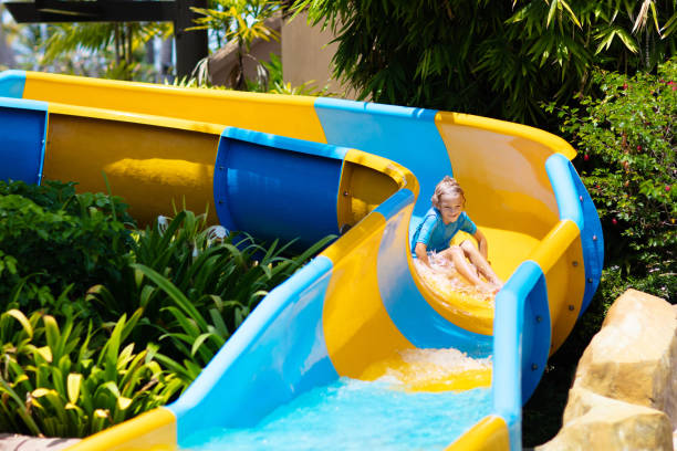 istock Kids on water slide in aqua park. Summer vacation 1490778512