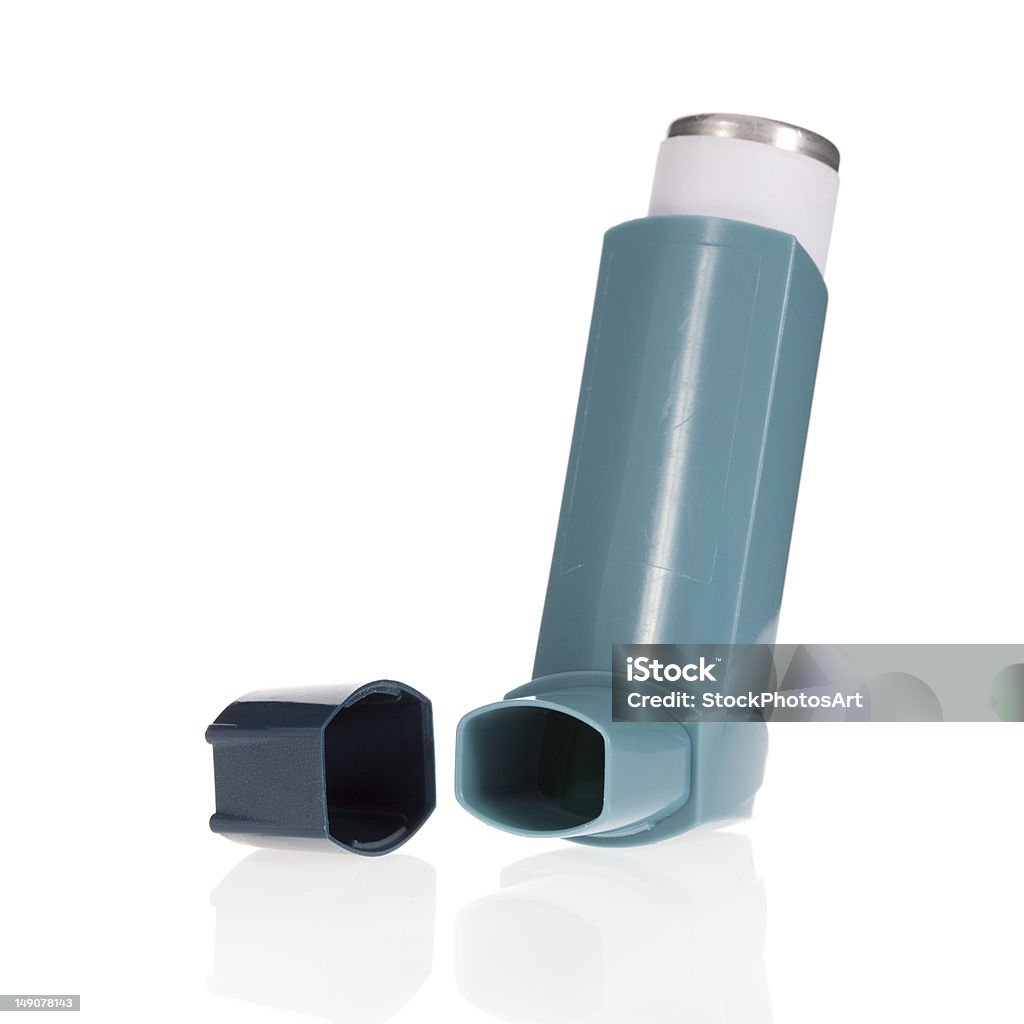 Blue asthma inhaler with cap isolated on white Asthma inhaler isolated on a white background Asthma Inhaler Stock Photo