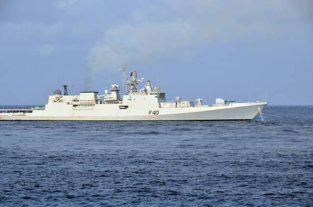Indian navy INS Talwar frigate (F40) - warship leaving Moroni, Comoros Moroni, Grande Comore / Ngazidja, Comoros islands: starboard view of INS Talwar F40, as it leaves Moroni - Talwar ('sword') Class Frigate - Designed by Severnoye Design Bureau, built at the Baltic Shipyard, Vasilyevsky Island, St Petersburg - Indian Navy Western Fleet warship - Talwar-class guided missile frigates are modified Krivak III-class frigates. Naval patrols in the Indian Ocean apply India's official policy: 'Project influence in India's maritime area of interest, to further the nation's political, economic and security objectives.' indian navy stock pictures, royalty-free photos & images