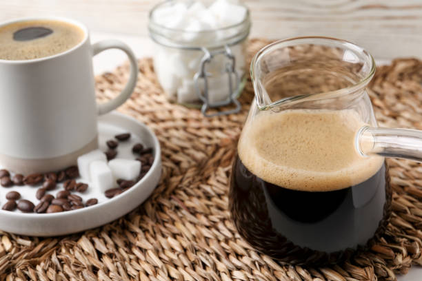istock Turkish coffee. Glass cezve and cup with hot aromatic coffee and sugar on wicker mat 1490783502