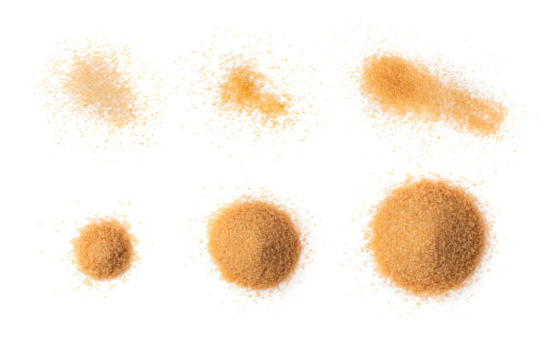 istock Raw Brown Cane Sugar Isolated on White Background 1490784363