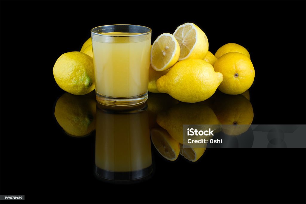 Still Life with lemons Still Life with lemons  and glass of juice Black Background Stock Photo