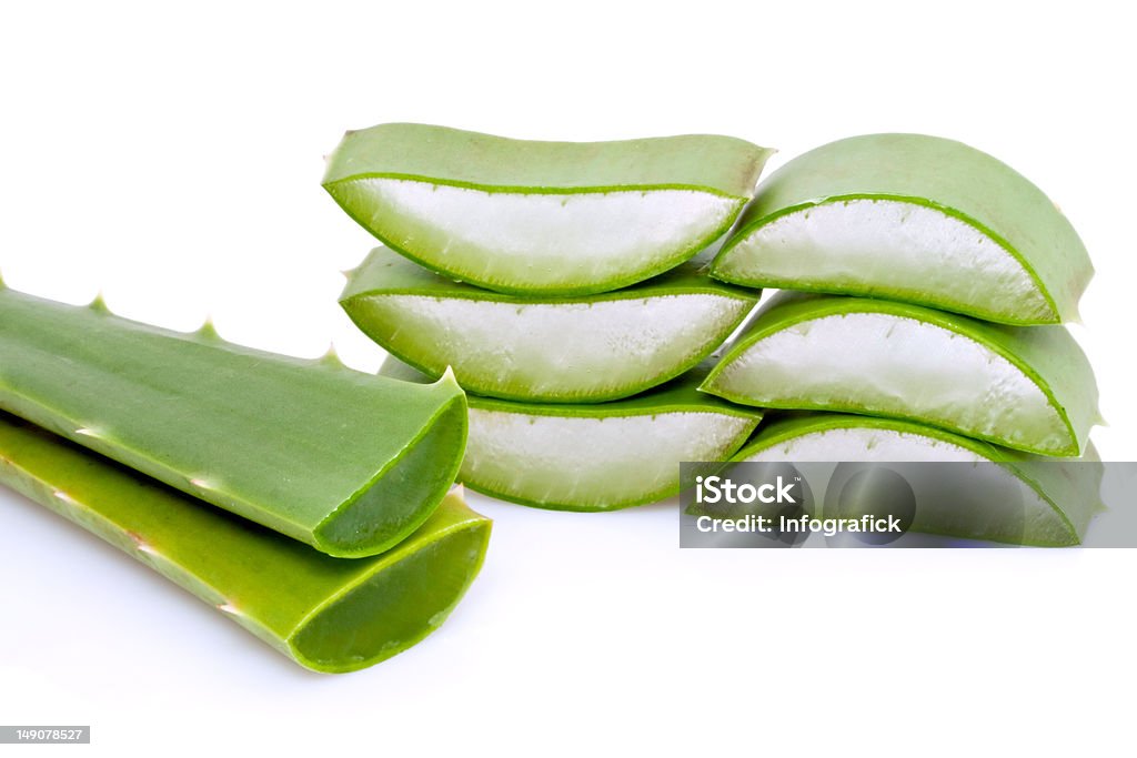 Green Aloe Vera slices Transparent gel in the center of medicinal Aloe Vera slices isolated against a white background Aloe Stock Photo