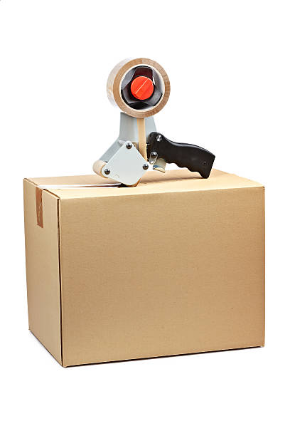 istock Packaging tape dispenser and shipping box 149079112