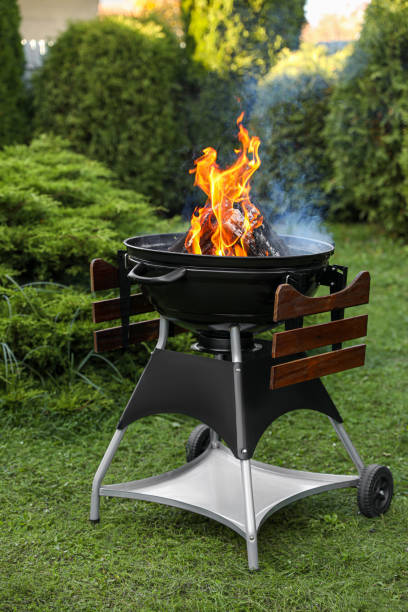 istock Portable barbecue grill with fire flames outdoors 1490791713