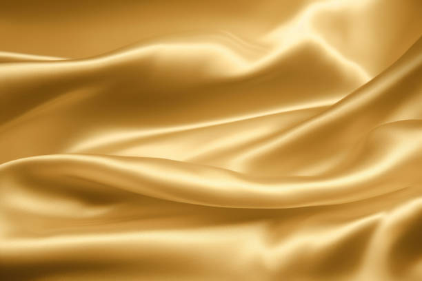 istock soft gold luxury silk fabric for background, Smooth elegant gold satin luxury and elegant backdrop, gold trend 1490794506