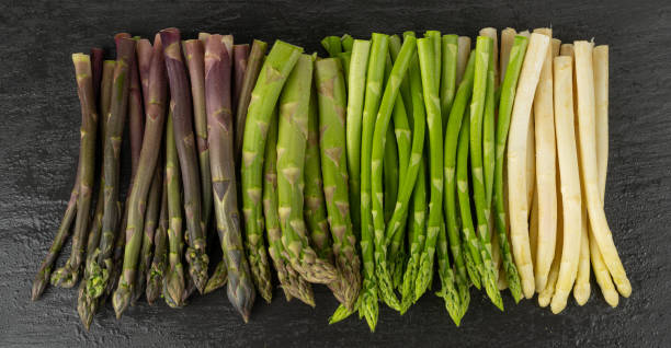 istock Raw Garden Asparagus, Fresh Green Spring Vegetables, Asparagus Officinalis Edible Sprouts 1490796346