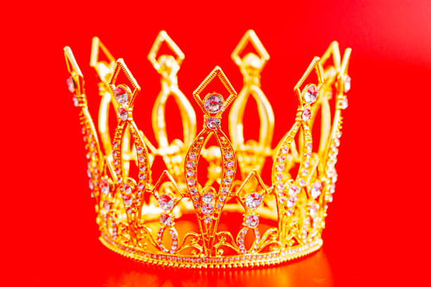 istock Golden Crown Isolated on a Red Background 1490801283