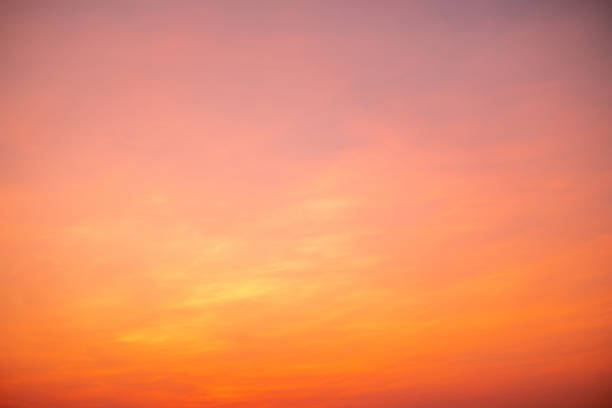 istock beautiful , luxury soft gradient orange gold clouds and sunlight on the blue sky perfect for the background, take in everning,Twilight 1490801564