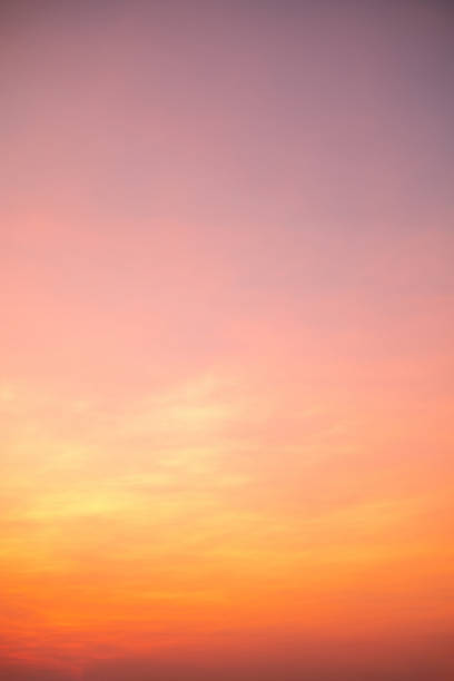 istock beautiful , luxury soft gradient orange gold clouds and sunlight on the blue sky perfect for the background, take in everning,Twilight, vertical image 1490801596