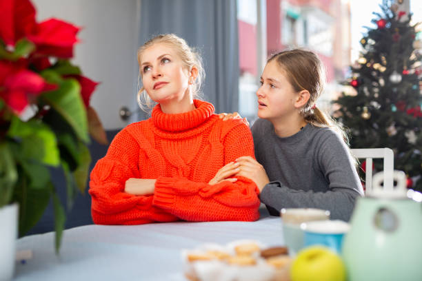 istock Daughter consoles mother 1490804710