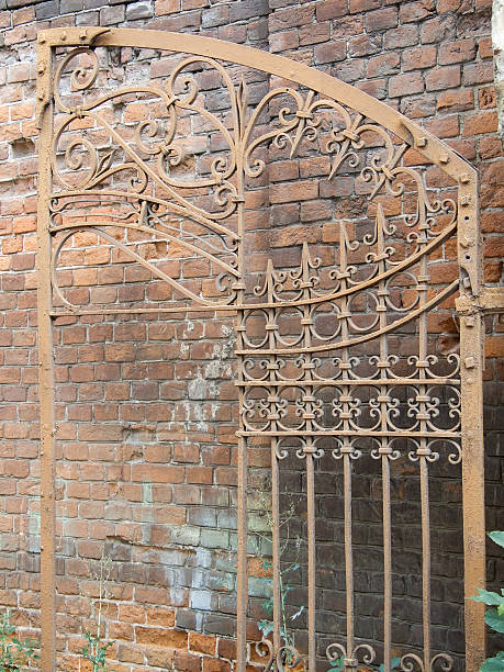 istock damaged gate on background of wall 149080998