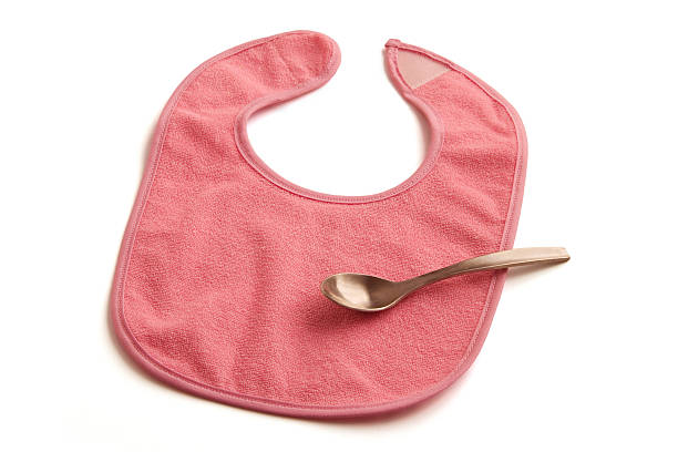 istock Pink Baby Bib with Spoon 149081089