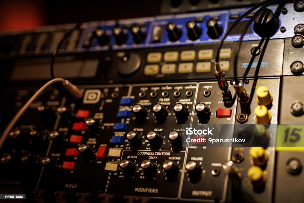 Sliders and knobs at an audio mixing console. Sliders and knobs at an audio mixing console Analog Stock Photo