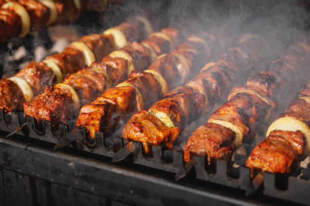 istock Grilled kebab cooking on metal skewer. 1490811211