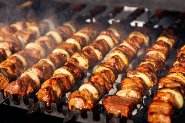 istock Grilled kebab cooking on metal skewer. 1490811239