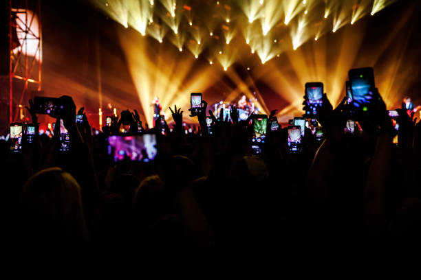 istock Smartphone crowd at a music event 1490811333