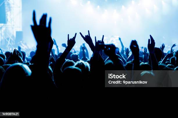 People With Raised Hands At A Music Concert Fans In Concert Hall Stock Photo - Download Image Now