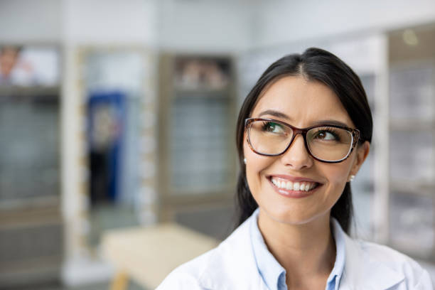 istock Happy optician working at an eyeglasses shop 1490813154