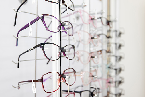 Close-up on glasses on display at an opticians shop - retail concepts