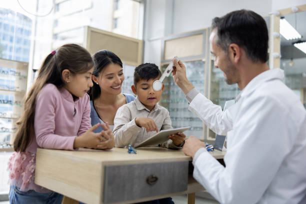 istock Mother taking her son to the optometrist for an eye exam 1490814461
