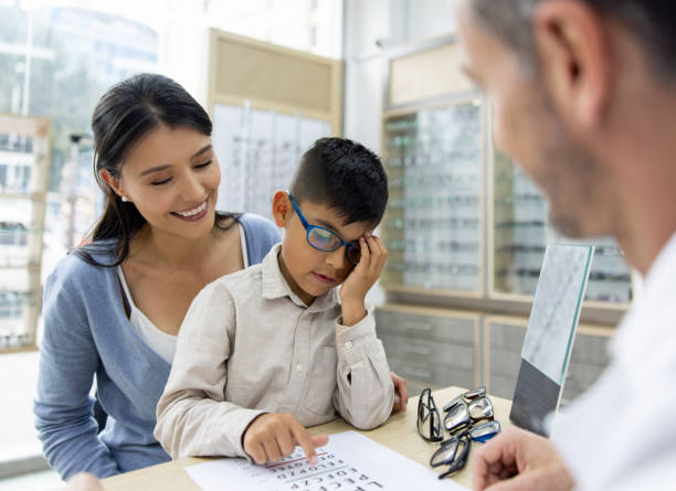 istock Mother taking her son to the optometrist for an eye exam 1490814503